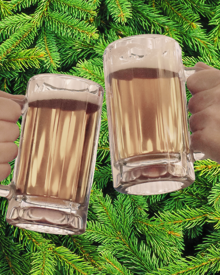 Spruce beer in two glasses clinking with a backdrop of spruce tips
